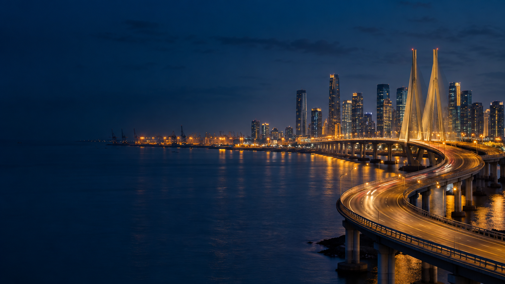 Modern bridge and business skyline at blue hour